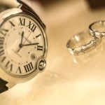 A watch and two marriage rings.